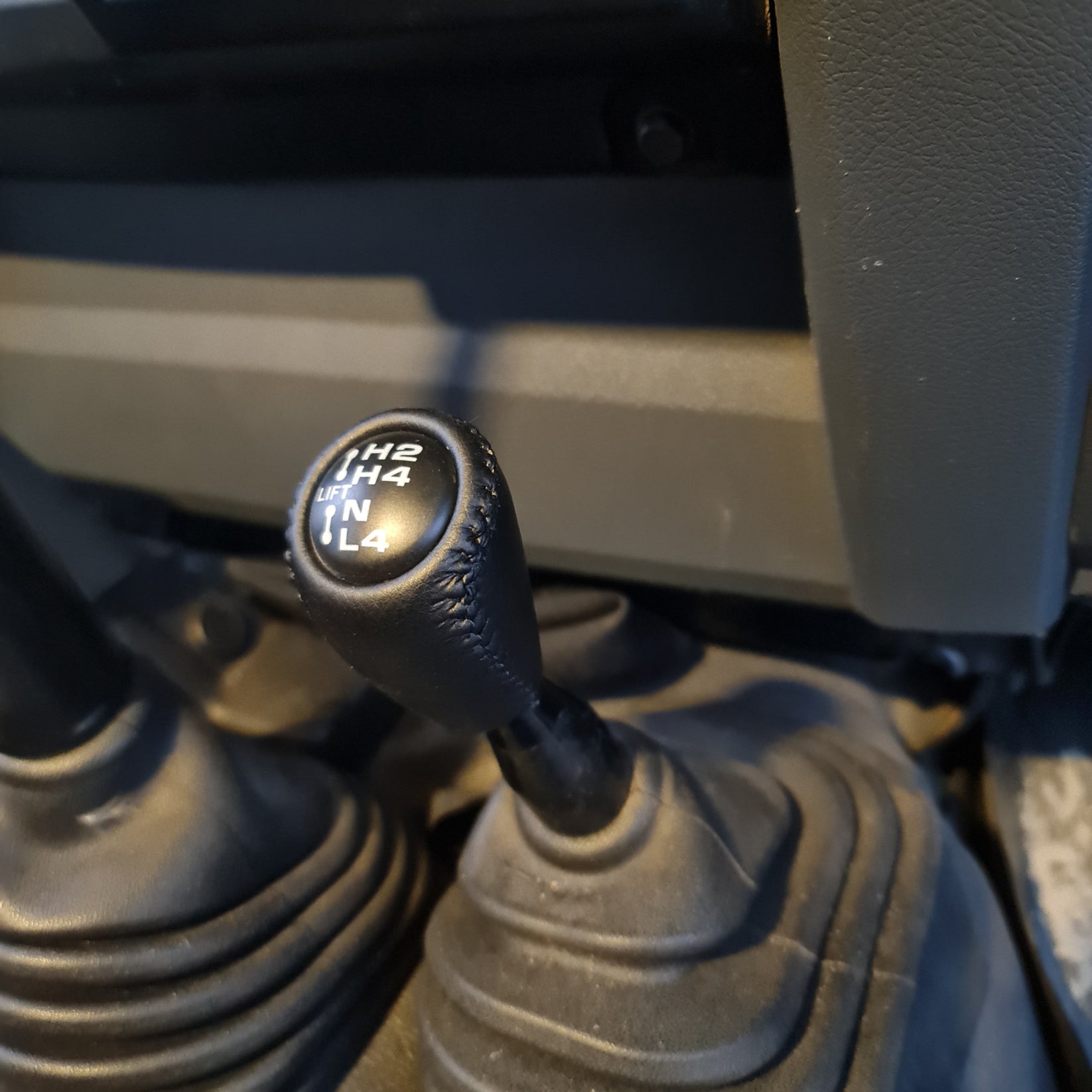 Close-up of a gear shift lever on a vehicle