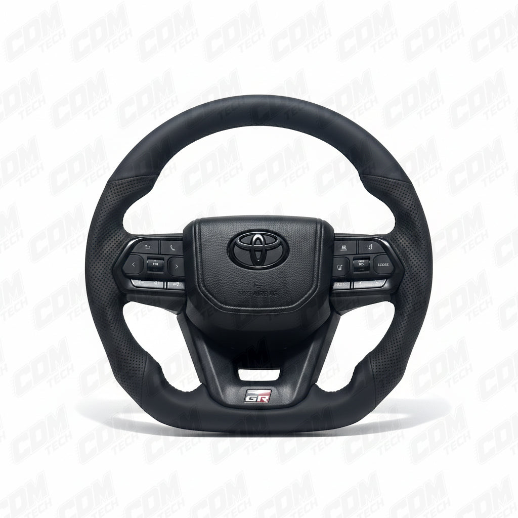 Black steering wheel with Toyota logo on a white background