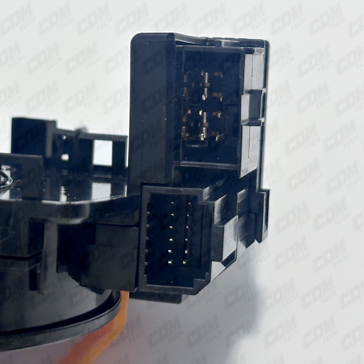 Close-up of a black automotive part on a white background